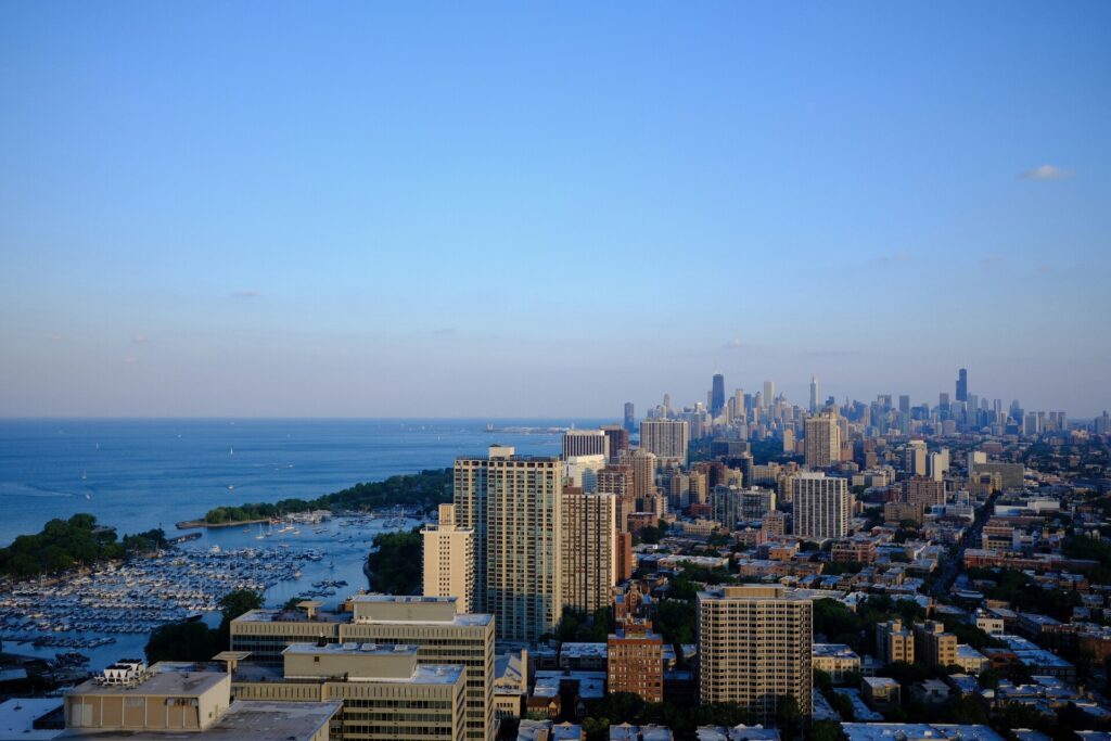 A coastal city skyline under a clear blue sky, representing a smooth long-distance relocation.