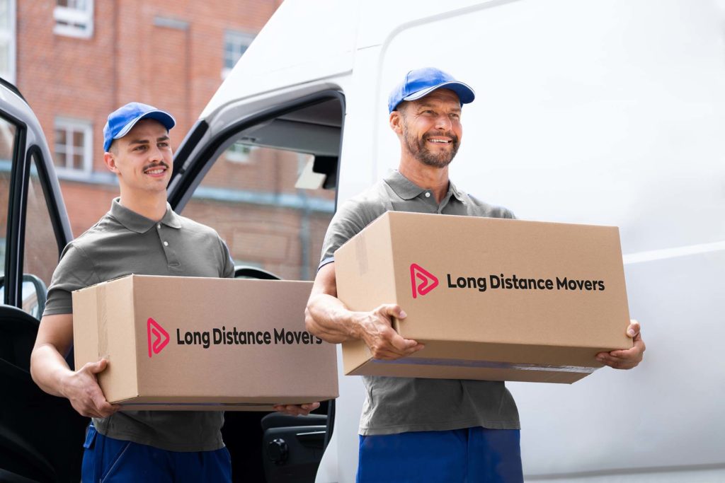 Long-distance movers loading a van