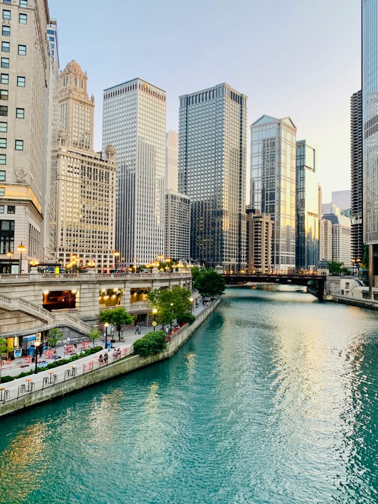 Chicago Riverwalk skyline with white and brown concrete buildings.