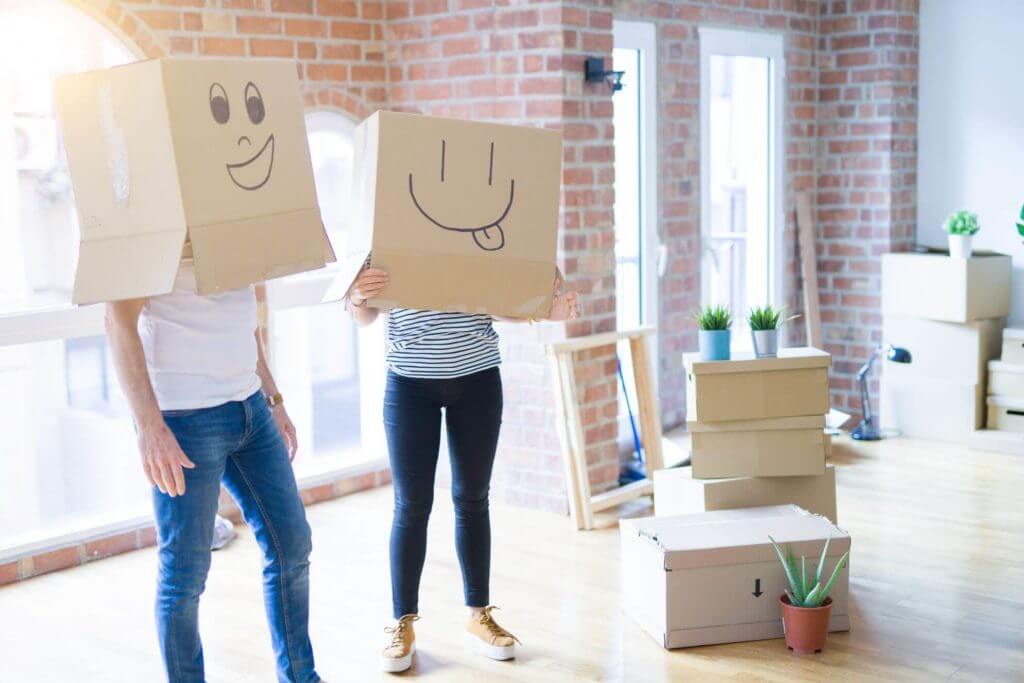 a couple with boxes on their heads