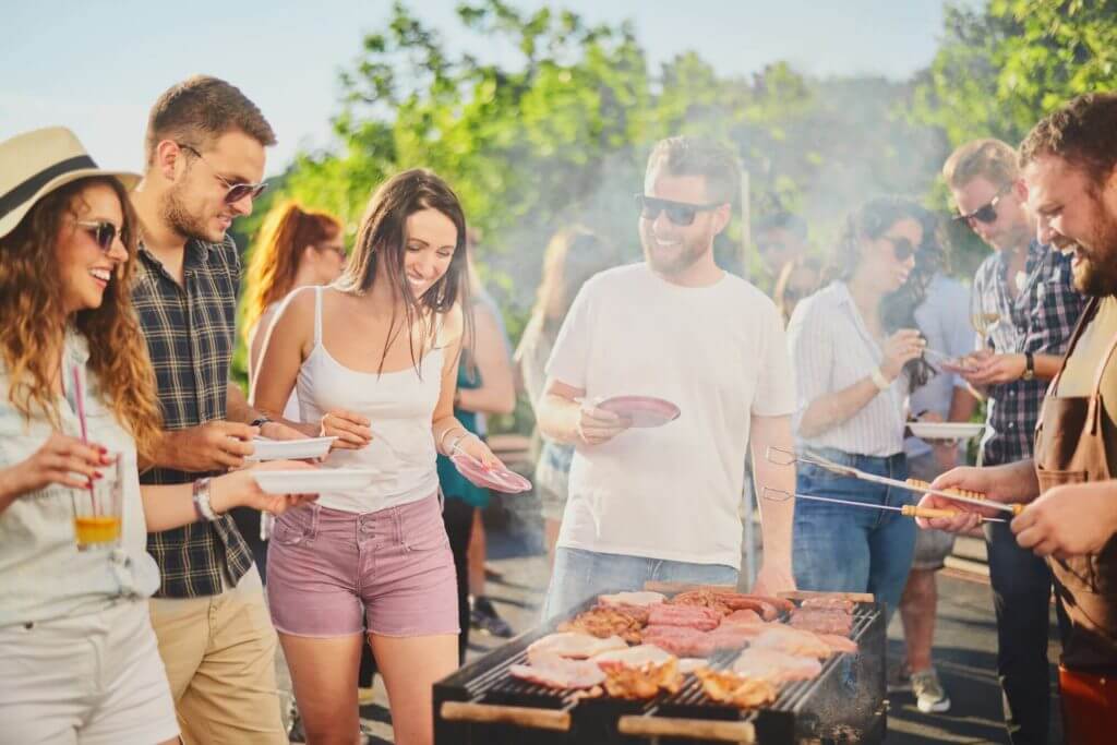 Group of people around the BBQ