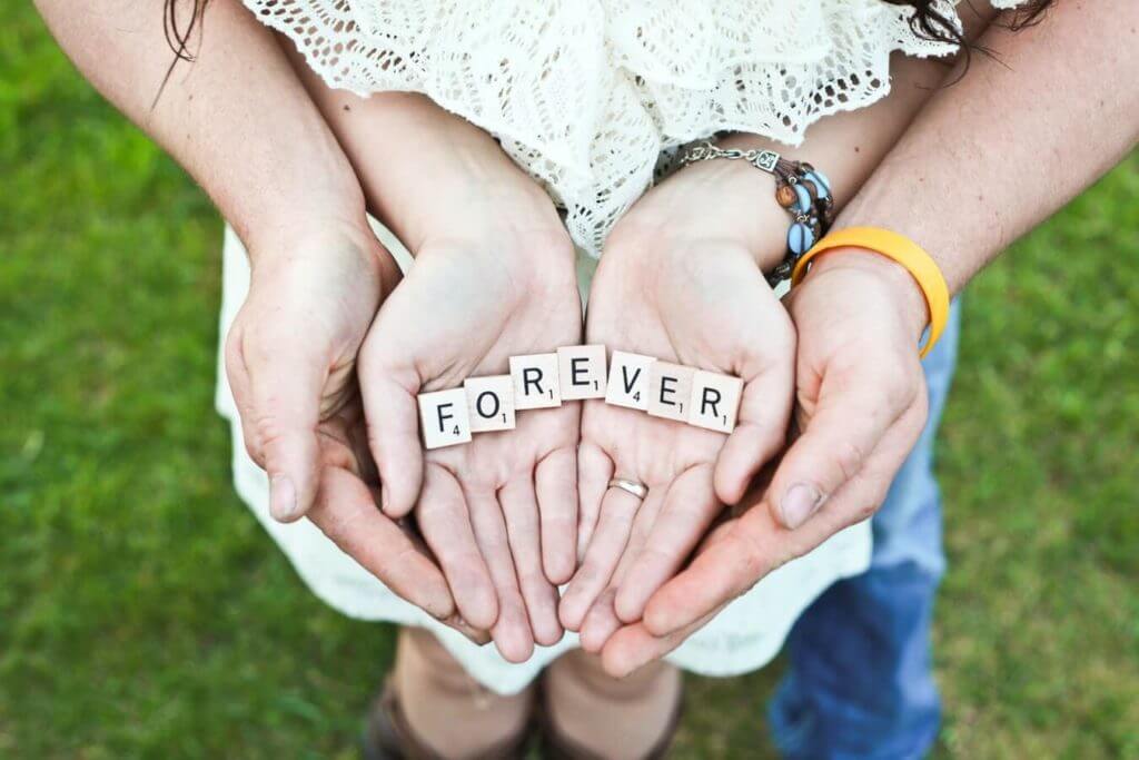 Hands holding forever sign