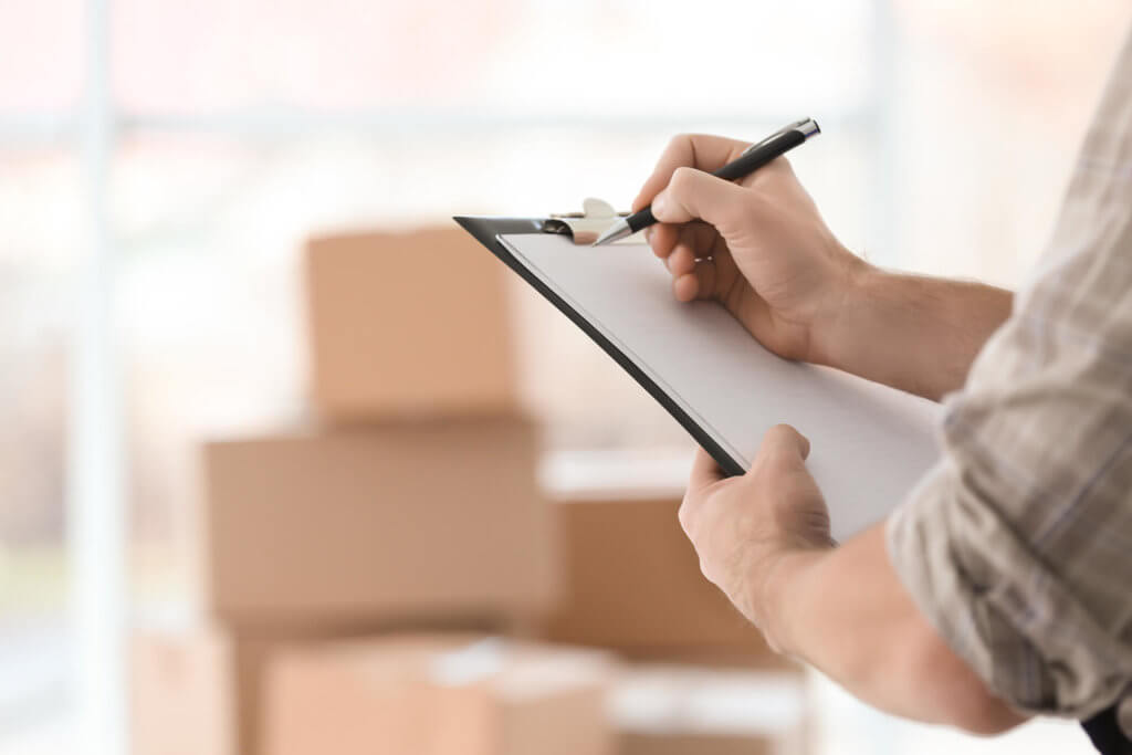 A long-distance mover listing the inventory before cross-country moving