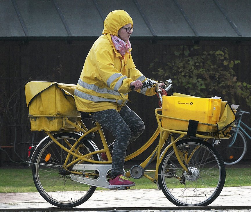 Mailwoman on a bike