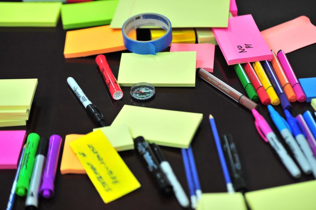 Sticky notes and colorful pens
