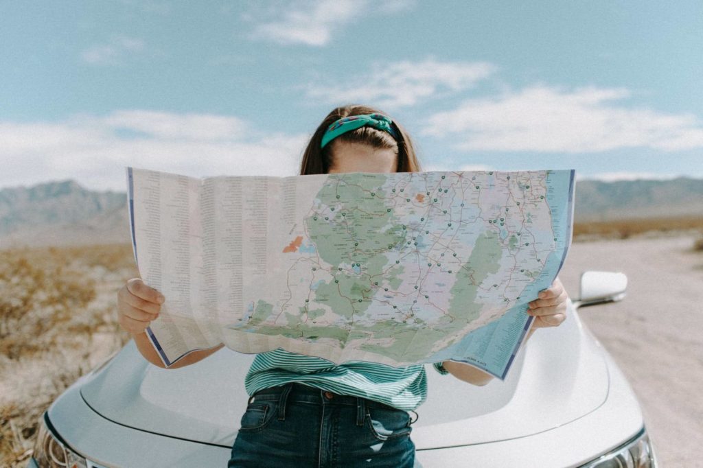 A girl looking at the map during long-distance moving 