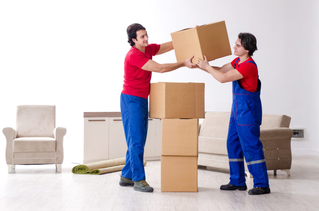 Long-distance movers packing belongings