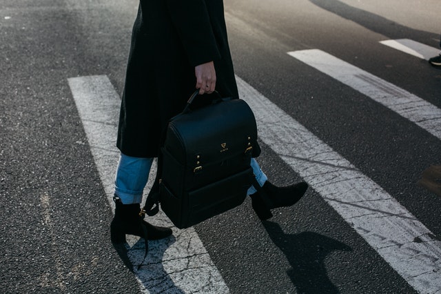 Woman carrying a bag for long-distance moving