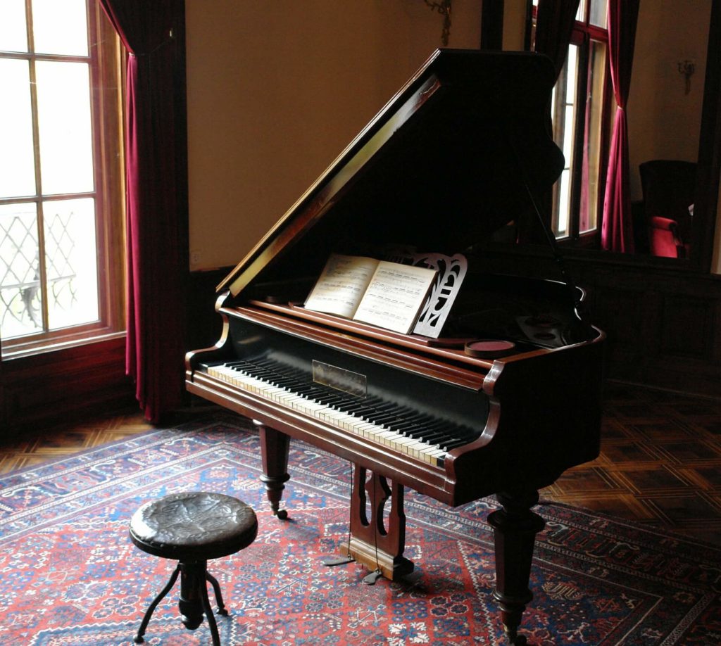 A piano on the carpet before cross-country moving 