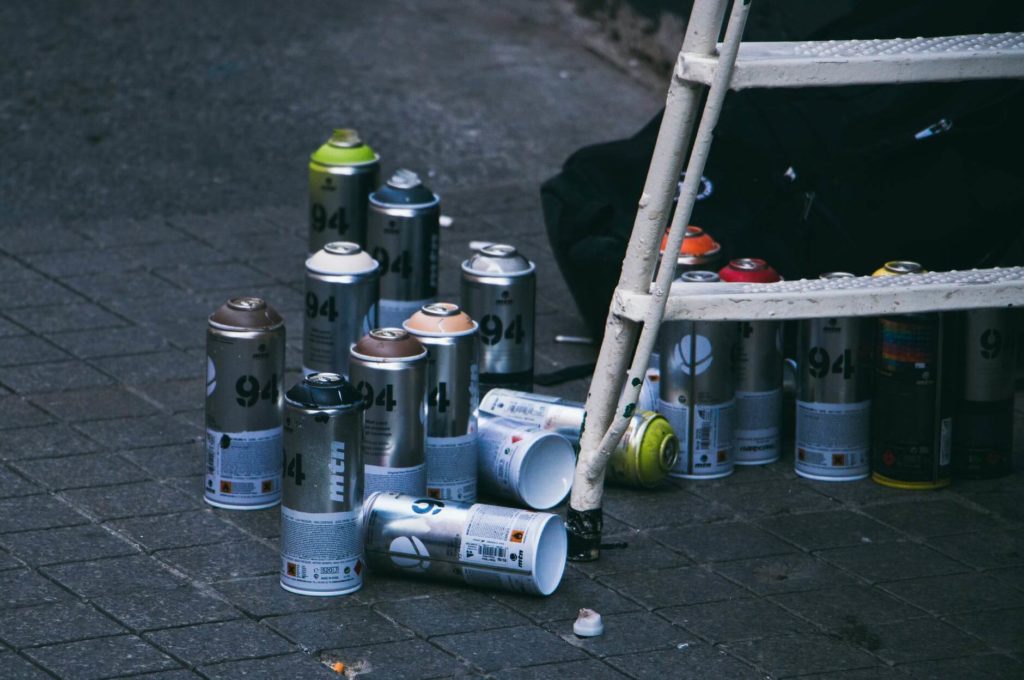 Spray cans on the ground
