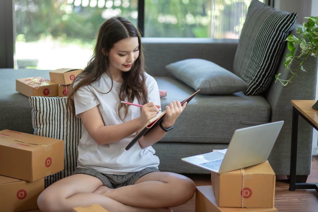 Girl writing a list after hiring long-distance movers