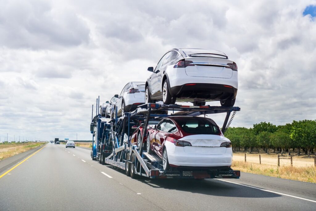 A truck carrying cars
