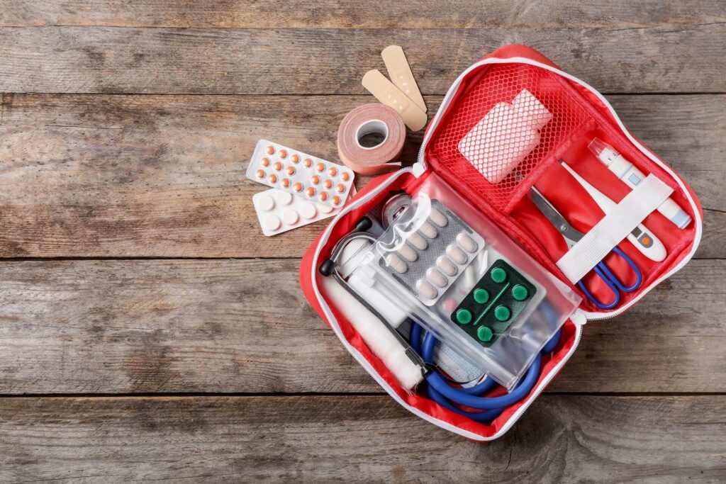 A view of a first aid kit filled with medicine and other equipment