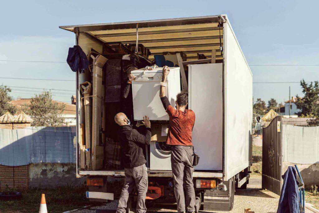 People loading a truck before cross-country moving