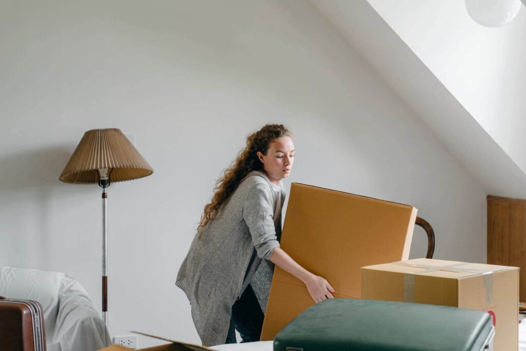 Woman moving large box