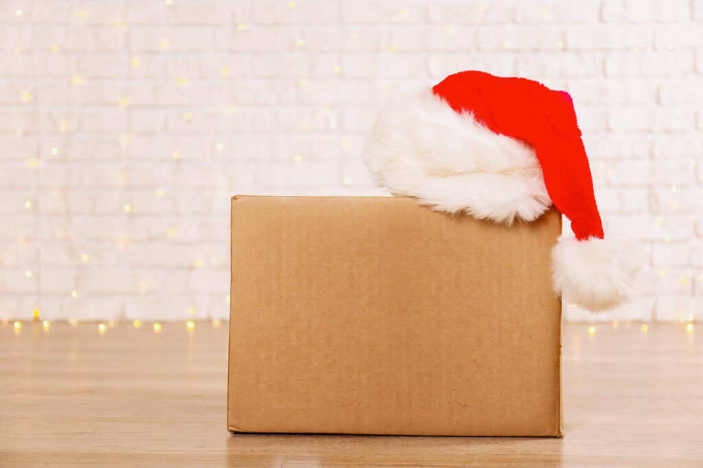 A box with a Santa hat on it