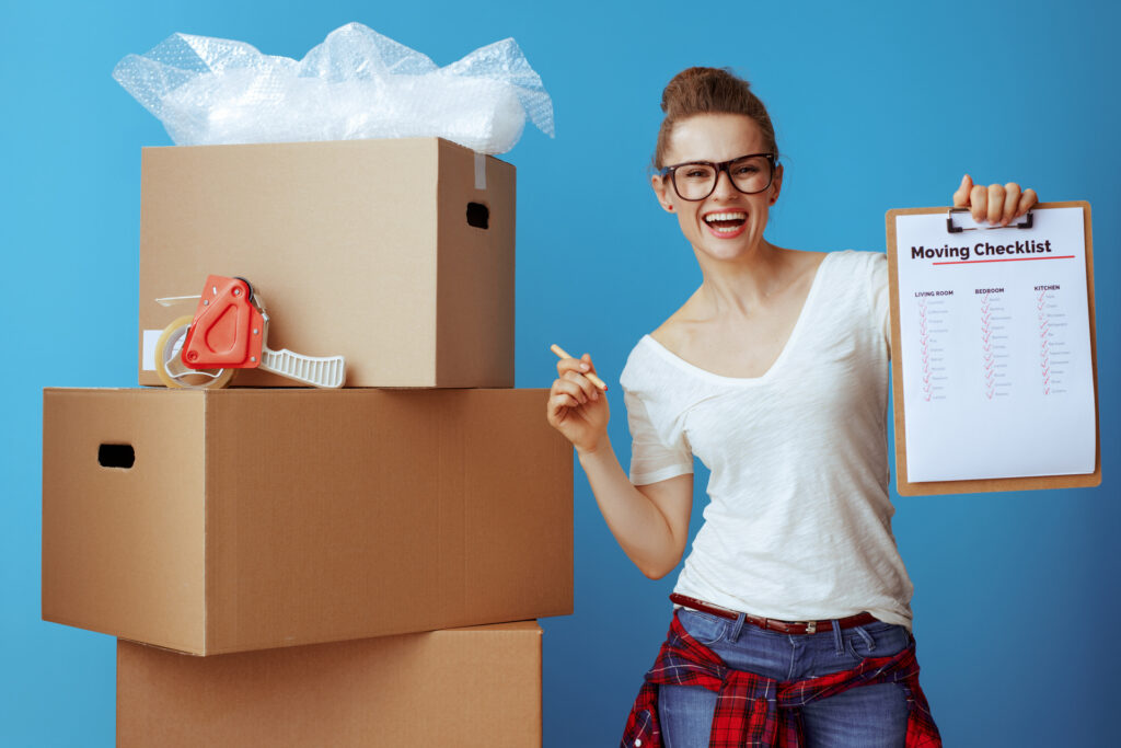  Boxes stacked in a living room during pre-move prep
