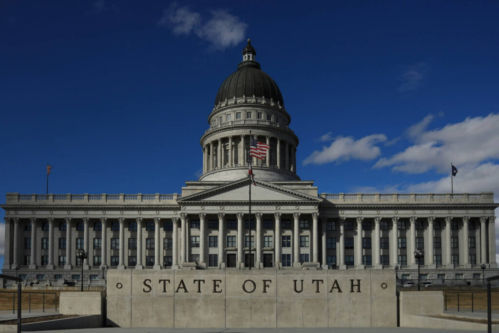 Utah State Capitol building with its classic dome on a clear, sunny day in Salt Lake City.